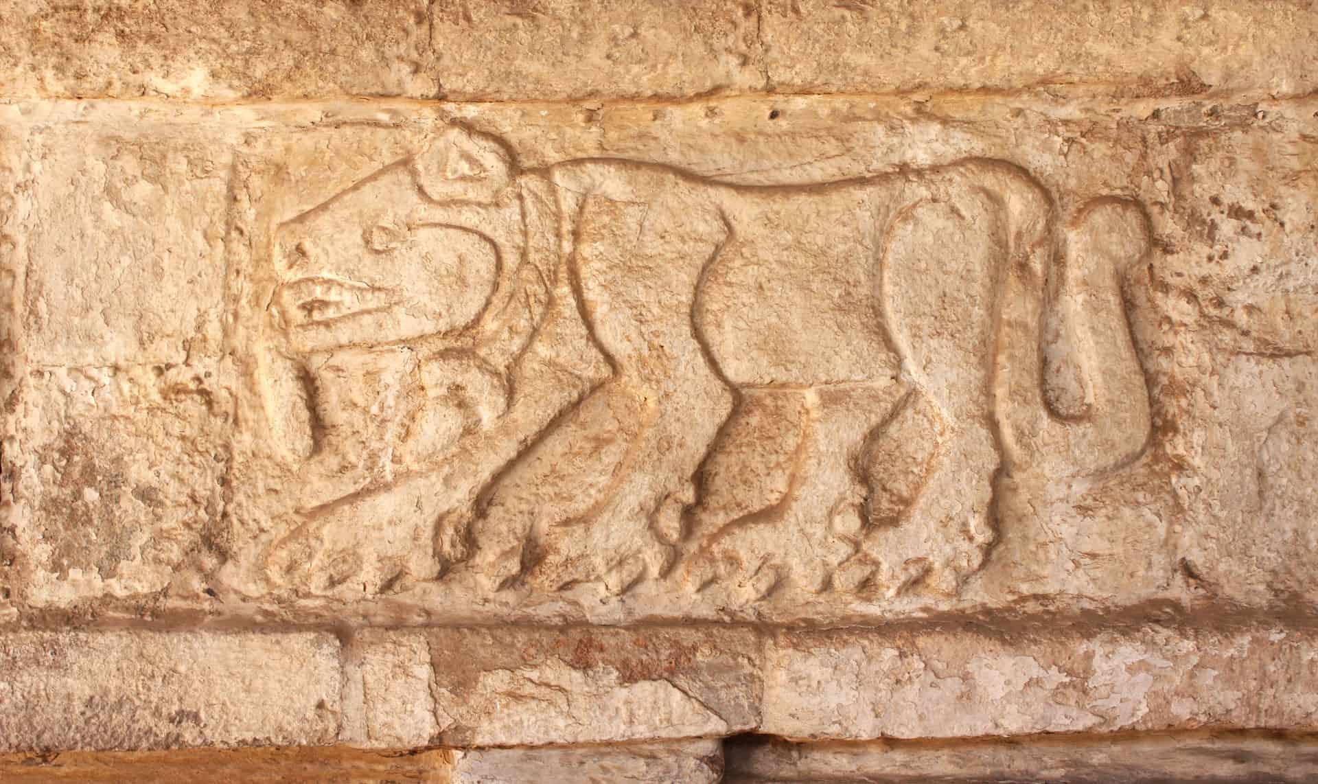 an old jaguar carving